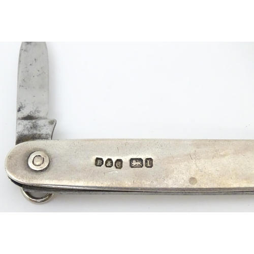 556 - A silver folding twin blade knife, hallmarked Sheffield 1903, maker Brookes & Crookes. Approx. 3