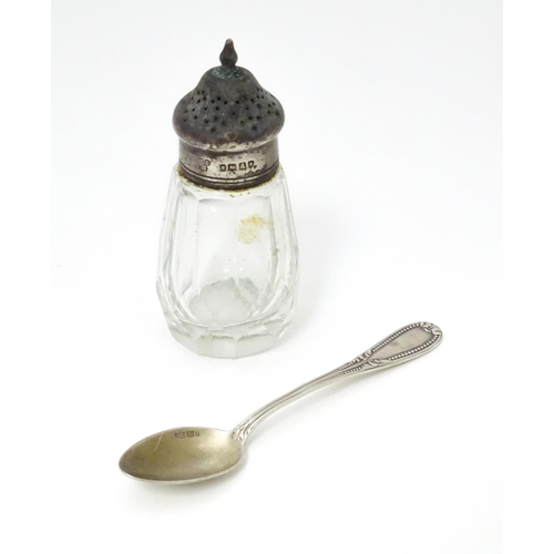 558 - A Victorian cut glass pepper with silver top hallmarked London 1876. Together with a German .800 sil... 