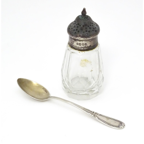 558 - A Victorian cut glass pepper with silver top hallmarked London 1876. Together with a German .800 sil... 