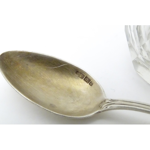 558 - A Victorian cut glass pepper with silver top hallmarked London 1876. Together with a German .800 sil... 