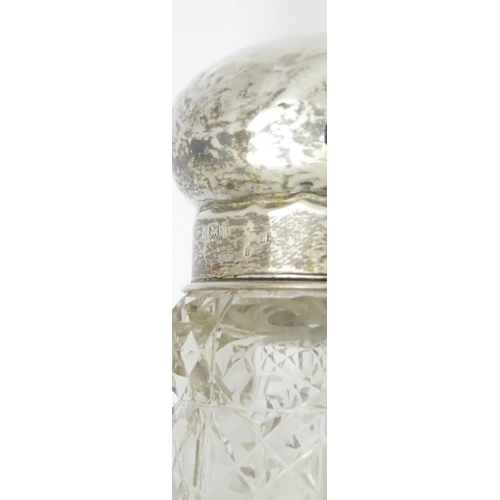 564 - A cut glass dressing table jar with hammered silver lid hallmarked Birmingham 1908, maker Walker & H... 