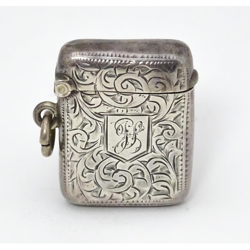 571 - A silver vesta case with engraved acanthus scroll decoration, hallmarked Birmingham 1907, maker Albe... 