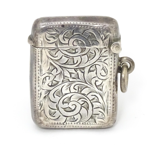 571 - A silver vesta case with engraved acanthus scroll decoration, hallmarked Birmingham 1907, maker Albe... 