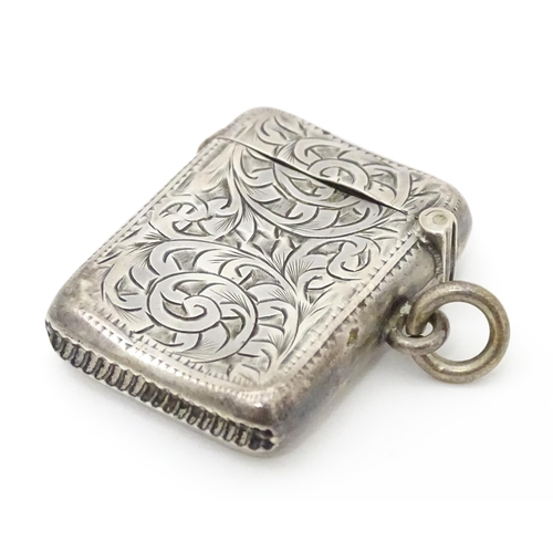 571 - A silver vesta case with engraved acanthus scroll decoration, hallmarked Birmingham 1907, maker Albe... 