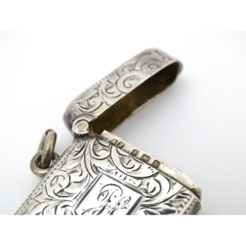 571 - A silver vesta case with engraved acanthus scroll decoration, hallmarked Birmingham 1907, maker Albe... 