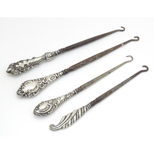 572 - Four assorted silver handled button hooks to include and example hallmarked Birmingham 1907. Largest... 