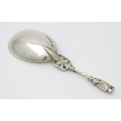 573 - A Victorian silver caddy spoon hallmarked London 1877, maker Henry Holland. Approx. 4