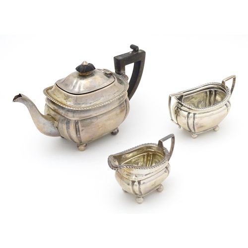 585 - A silver bachelors tea set comprising teapot, cream jug and sugar bowl, hallmarked Sheffield 1907, m... 