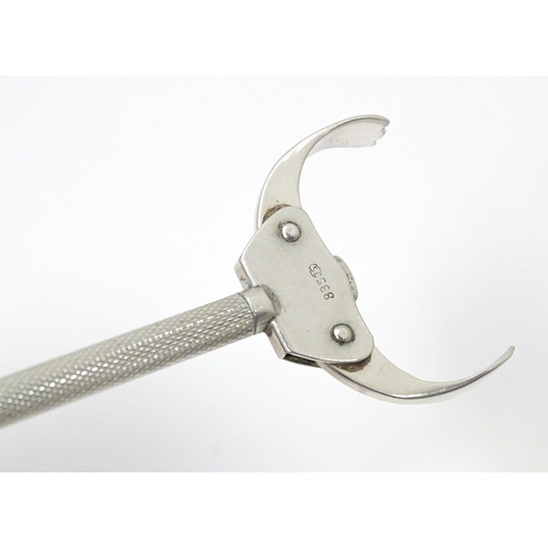 590 - Continental .835 silver lever action sugar tongs with engine turned decoration and sprung grips. App... 