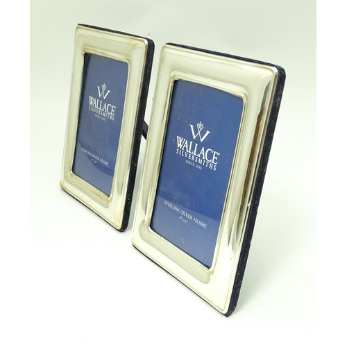 594 - A pair of photograph frames with silver surrounds hallmarked Wallace Sterling .925. Each approx. 8