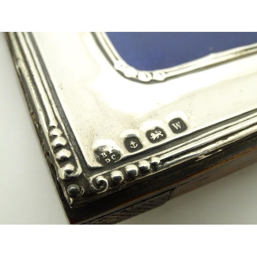 595 - A photograph frame with silver surround,  hallmarked Birmingham 1921 maker Boots Pure Drug company. ... 