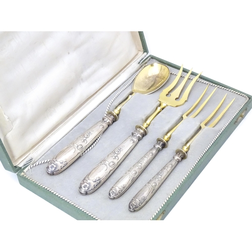 605 - A cased Art Nouveau German .800 silver handled serving set, the handles decorated with strawberries,... 