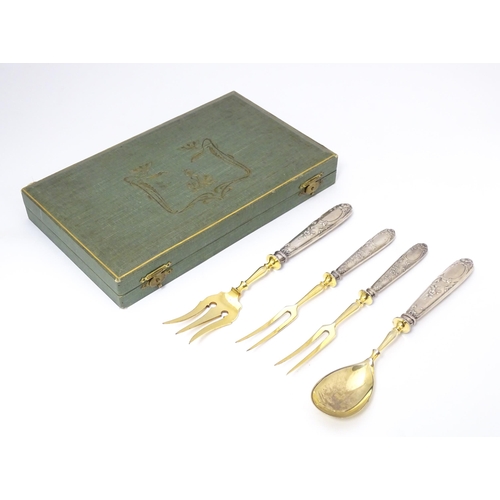 605 - A cased Art Nouveau German .800 silver handled serving set, the handles decorated with strawberries,... 