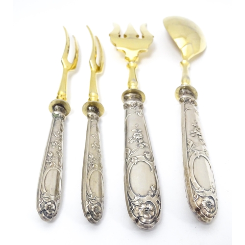 605 - A cased Art Nouveau German .800 silver handled serving set, the handles decorated with strawberries,... 