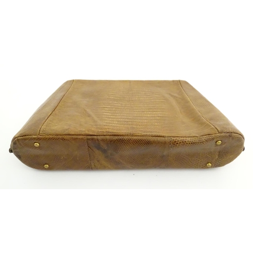 1179 - A late 19thC / early 20thC pig skin travelling vanity case of satchel form with blue leather lining,... 