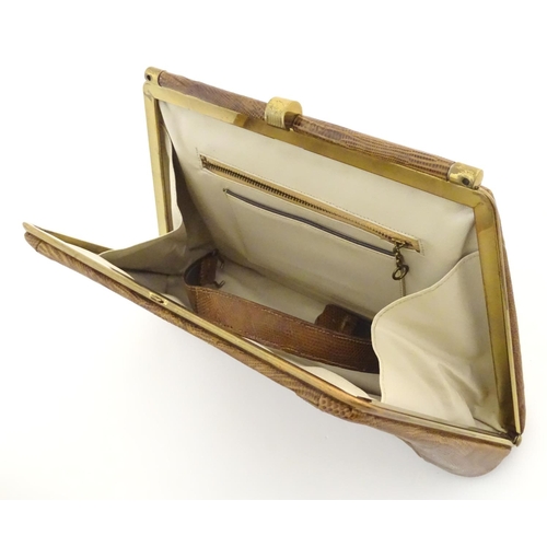 1179 - A late 19thC / early 20thC pig skin travelling vanity case of satchel form with blue leather lining,... 