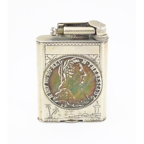 1195 - A pocket lighter, engraved with native scenes and inset with Thaler coin style detail, approx 2 7/8