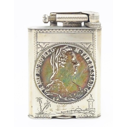 1195 - A pocket lighter, engraved with native scenes and inset with Thaler coin style detail, approx 2 7/8