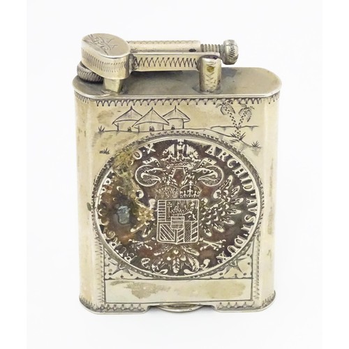 1195 - A pocket lighter, engraved with native scenes and inset with Thaler coin style detail, approx 2 7/8