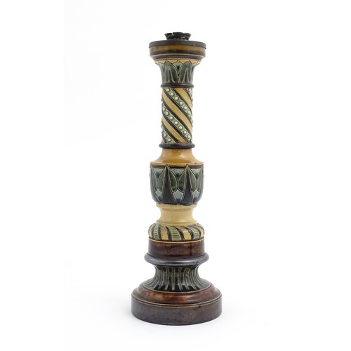 120 - A large stoneware candlestick with banded decoration. In the manner of Doulton. Approx. 15 1/4