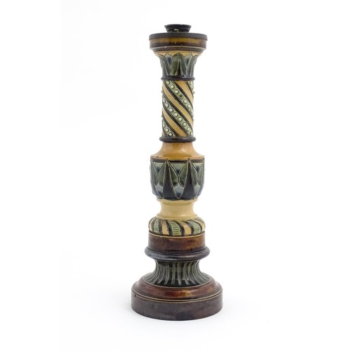 120 - A large stoneware candlestick with banded decoration. In the manner of Doulton. Approx. 15 1/4