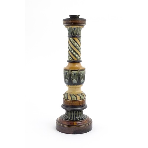 120 - A large stoneware candlestick with banded decoration. In the manner of Doulton. Approx. 15 1/4