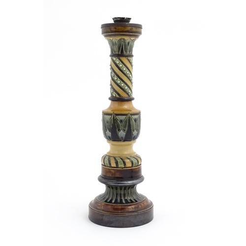 120 - A large stoneware candlestick with banded decoration. In the manner of Doulton. Approx. 15 1/4