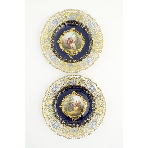 191 - Two Meissen cabinet plates with pierced floral and foliate borders, the centre decorated with a hand... 