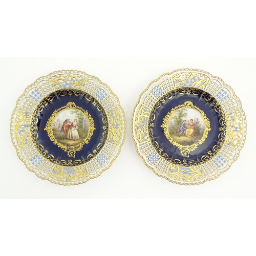 191 - Two Meissen cabinet plates with pierced floral and foliate borders, the centre decorated with a hand... 