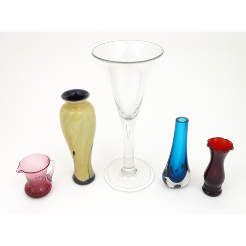 263 - A quantity of glassware to include a Caithness vase in the ebony pattern, oversized / display wine g... 