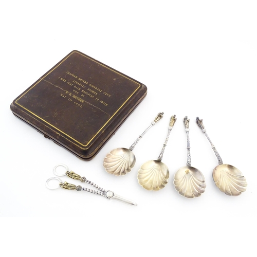 421 - A silver plate fruit serving set comprising servers and grape shears, with gilded shell formed bowls... 