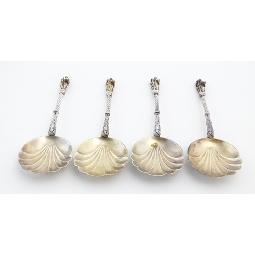 421 - A silver plate fruit serving set comprising servers and grape shears, with gilded shell formed bowls... 