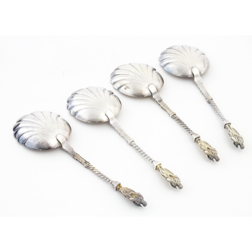 421 - A silver plate fruit serving set comprising servers and grape shears, with gilded shell formed bowls... 