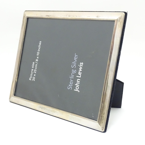 593 - A large photograph frame with silver surround. Hallmarked Sheffield  2010 maker Carrs's of Sheffield... 