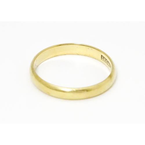 643 - A 14ct gold wedding band marked 585 RDJ and  maker Scheel . Ring size approx. Q 1/2