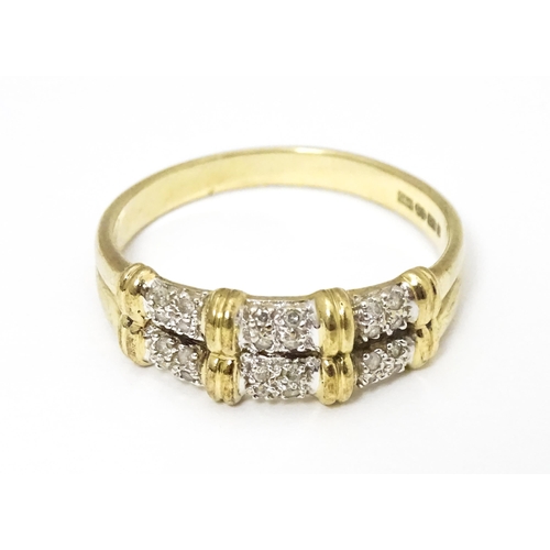 644 - A 9ct gold ring having double band detail with six segments each set with four diamonds. Ring size a... 