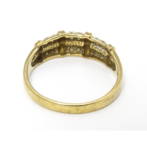 644 - A 9ct gold ring having double band detail with six segments each set with four diamonds. Ring size a... 