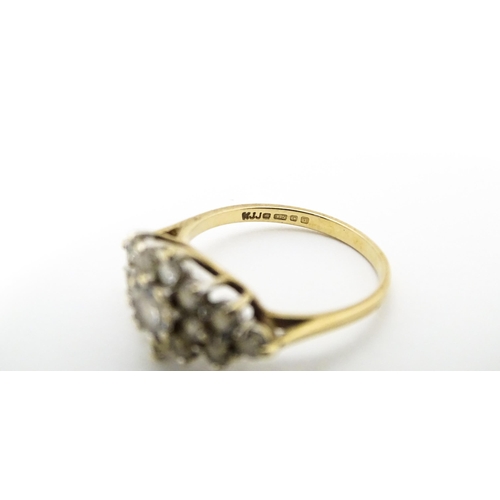 649 - A 9ct gold ring set with cluster of white stones. Ring size approx. J 1/2