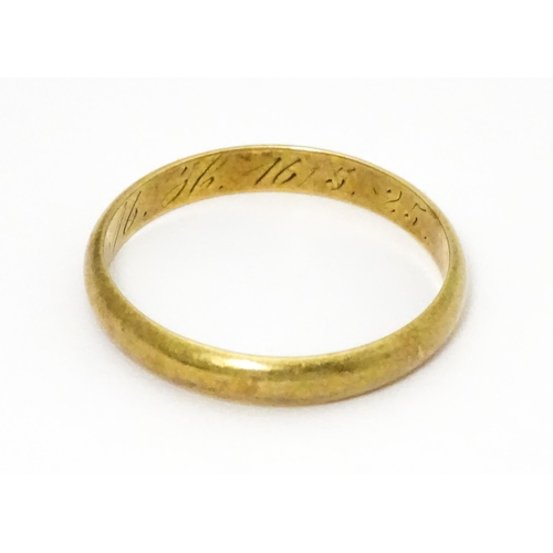 652 - A 14ct gold wedding band marked 585 RDJ and  maker Scheel . Ring size approx. W.