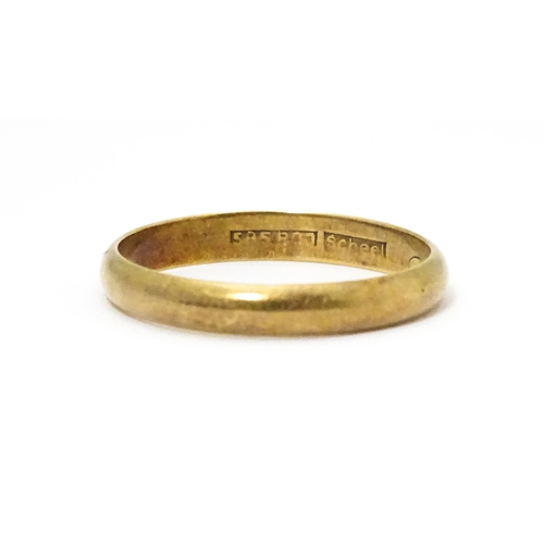 652 - A 14ct gold wedding band marked 585 RDJ and  maker Scheel . Ring size approx. W.