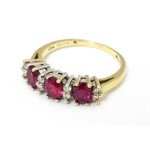 664 - A 9ct gold ring set with rubies and diamonds. Ring size approx K 1/2