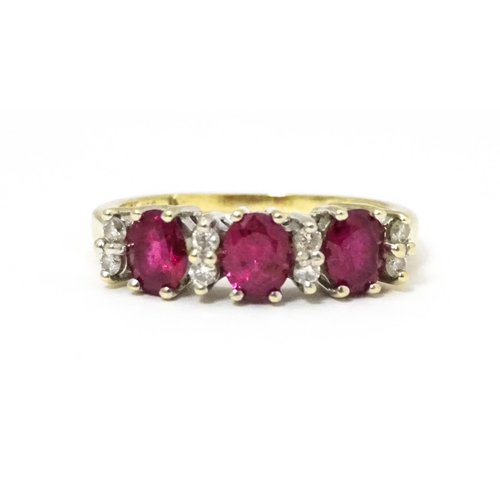 664 - A 9ct gold ring set with rubies and diamonds. Ring size approx K 1/2