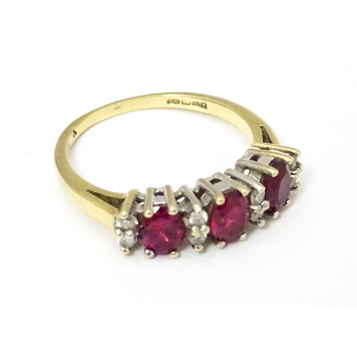 664 - A 9ct gold ring set with rubies and diamonds. Ring size approx K 1/2