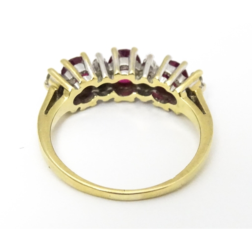 664 - A 9ct gold ring set with rubies and diamonds. Ring size approx K 1/2