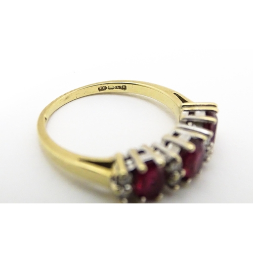 664 - A 9ct gold ring set with rubies and diamonds. Ring size approx K 1/2