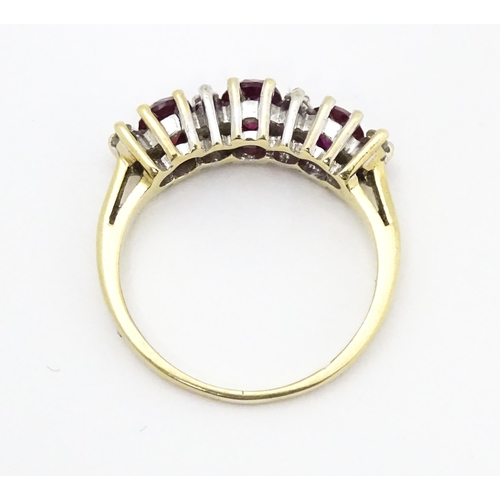 664 - A 9ct gold ring set with rubies and diamonds. Ring size approx K 1/2