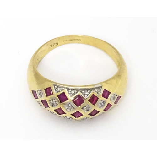 671 - A 9ct gold ring set with rubies and diamonds. Ring size approx  L 1/2