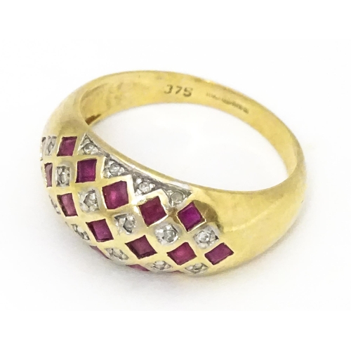 671 - A 9ct gold ring set with rubies and diamonds. Ring size approx  L 1/2