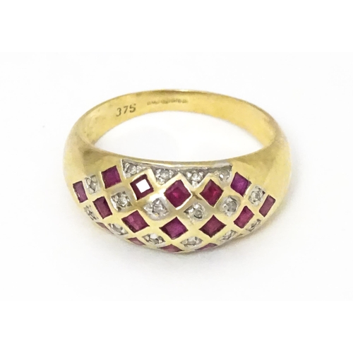 671 - A 9ct gold ring set with rubies and diamonds. Ring size approx  L 1/2