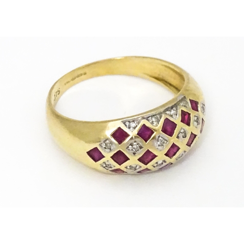 671 - A 9ct gold ring set with rubies and diamonds. Ring size approx  L 1/2